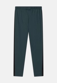 Nike Performance ACADEMY 23 PANT BRANDED UNISEX - Donji dijelovi trenirke - vintage green/black/white