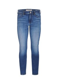 Jeans ajustados de denim azul medio con un lavado desgastado. Presenta cinco bolsillos y un cierre de botón. Dobladillo recto en el tobillo.