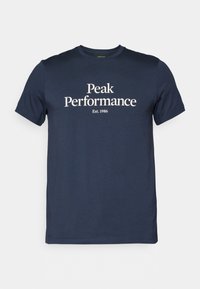 Camiseta de algodón azul marino de manga corta, con el texto blanco "Peak Performance" y "Est. 1986" centrado en el frente.