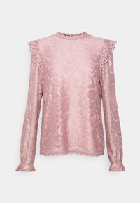 Top in pizzo a maniche lunghe di un delicato rosa antico, con colletto scallop, dettagli di spalline arricciate e intricate fantasie floreali su tutto il capo.