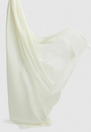 Kerge, läbipaistev valge kangas langeb elegantselt, rõhutades pehmet tekstuuri ja kulunud servi, luues voolava ja õrna välimuse.