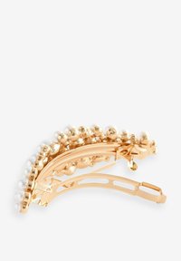 Clip per capelli in oro con dettagli in perle e una finitura testurizzata. Forma curvata con chiusura per una presa sicura. Elegante e decorativo.