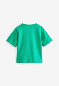 Grön kortärmad t-shirt av mjuk bomull. Har en rund nacke och en enhetlig färg utan synliga mönster eller detaljer.