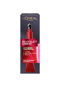 Un tube rouge avec un embout applicateur argenté, présentant une boîte bleue foncée et des accents rouges. Le texte met en avant les avantages du sérum en français et en anglais.