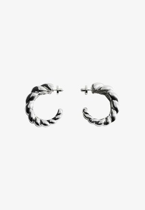 Pair of twisted silver metal hoop earrings with post backings displayed on a white background.