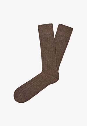 Brązowe skarpetki prążkowane, wykonane z wełny, z teksturowanym materiałem i mankietem u góry. Wzór obejmuje pionowe prążki na całej długości.