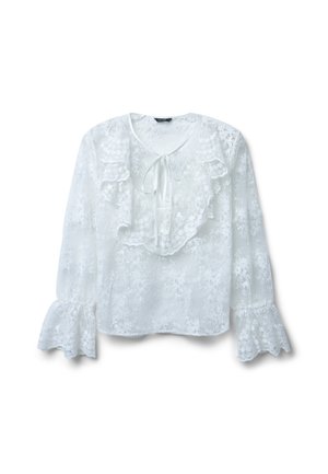 Camicia bianca con una texture in pizzo floreale, colletto arricciato, chiusura a legatura e maniche svasate. Tessuto leggero e dettagli delicati.