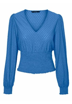 Blouse bleue à manches longues avec motif carré texturé, col en V, taille froncée et poignets ajustés.
