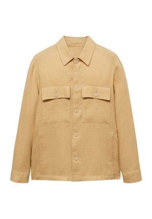 Beige liinajakk klassikalise kraega, kahe rinna-taskuga ja ees asuva nupuga sulgemisega. Omab pikki varrukaid ja sirget lõiget.