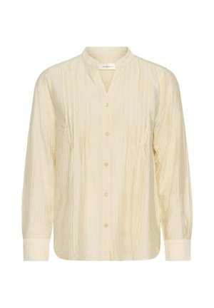 Blusa de manga larga color crema con cuello mandarín, cierre de botones en la parte delantera, rayas verticales texturizadas y corte holgado.