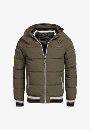 Olive green puffer jacket with a hood, featuring multiple zippered pockets, ribbed cuffs, and a striped hem. Textured quilted pattern throughout.