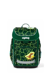 Zaino verde con motivo a guscio di tartaruga, tessuto testurizzato, tasca frontale con cerniera, dettagli riflettenti e grafica di un dinosauro.