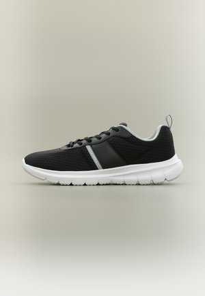 Black and white athletic sneaker with mesh fabric, black laces, white sole, and pull tab at heel, shown in side profile on plain background.