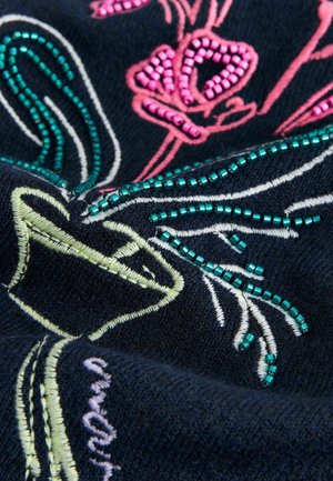 Navy fabric featuring vibrant floral embroidery in pink and green, embellished with iridescent beads, creating a textured design.
