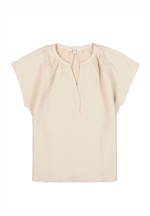 Haut beige clair en tissu texturé, avec des manches courtes, un col rond avec une petite patte de boutonnage et une coupe décontractée.