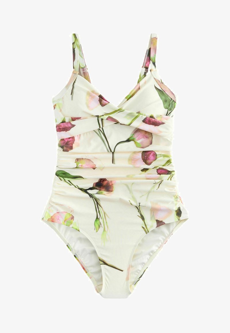 Costume intero con steli verdi e stampa floreale rosa, fiancate arricciate e spalline regolabili su sfondo bianco.