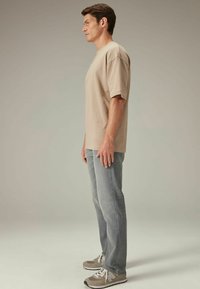 Next MOTION FLEX STRETCH - Straight leg -farkut - light grey