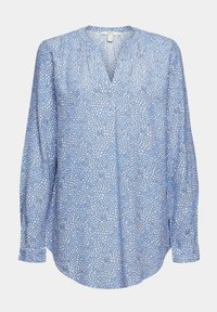 Blusa blu con scollatura a V, maniche lunghe e motivo floreale di forme bianche e blu scure su tessuto leggero. Orlo arrotondato.