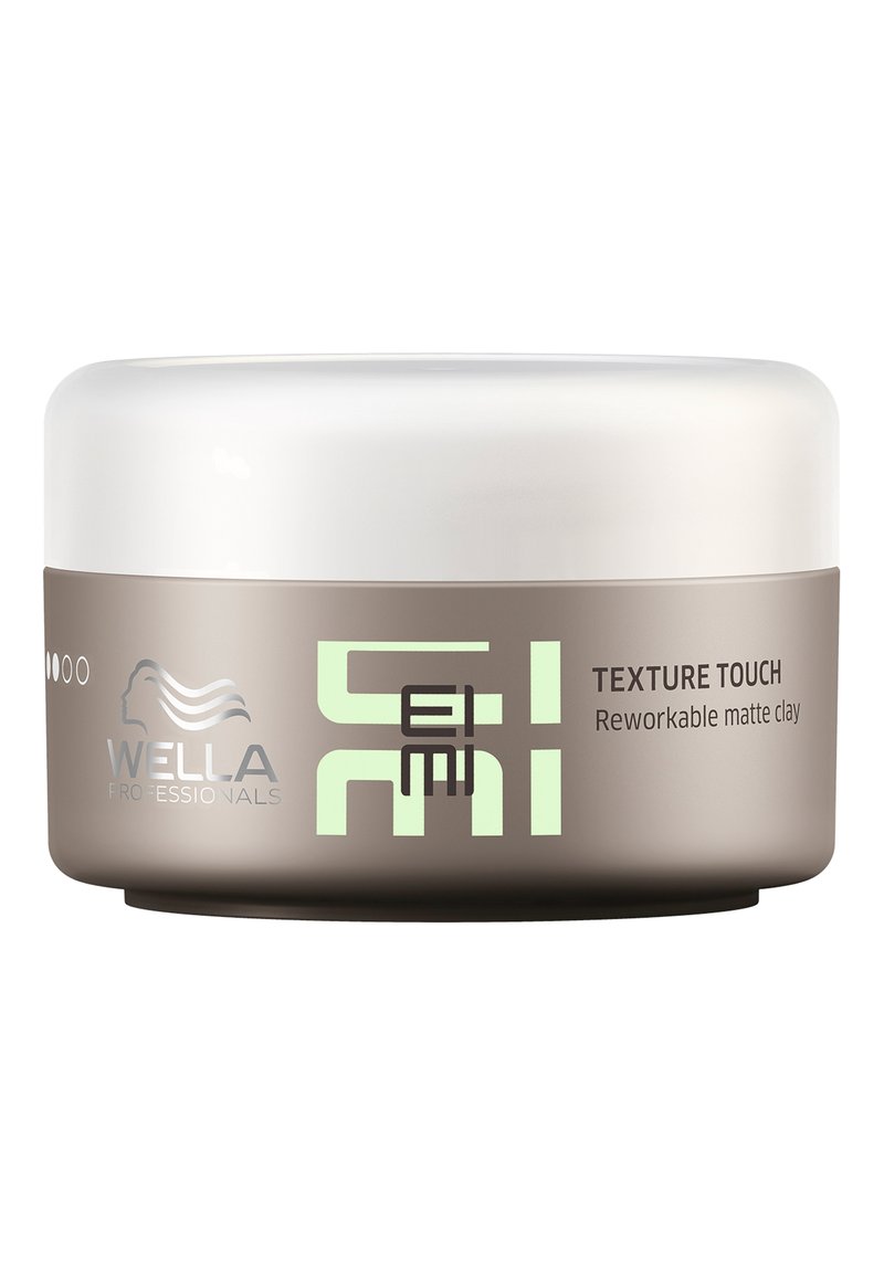 Wella Professionals Texture Touch genanvendelig mat ler i en rund, frostet hvid og taupe-container med grøn tekst.
