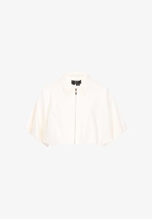 Fehér, rövid derekú dzseki, rövid, széles ujjakkal, gallérral és elöl cipzáras záródással.