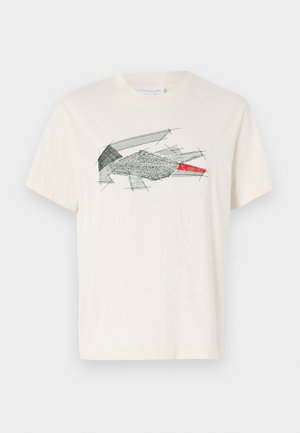 Crème t-shirt van katoen met een groen en rood abstract borduur ontwerp. Korte mouwen en een ronde hals.
