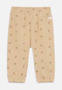 Pantalons en coton beiges avec taille élastique et poignets froncés, ornés d'un motif de montgolfières marron clair sur tout le vêtement.