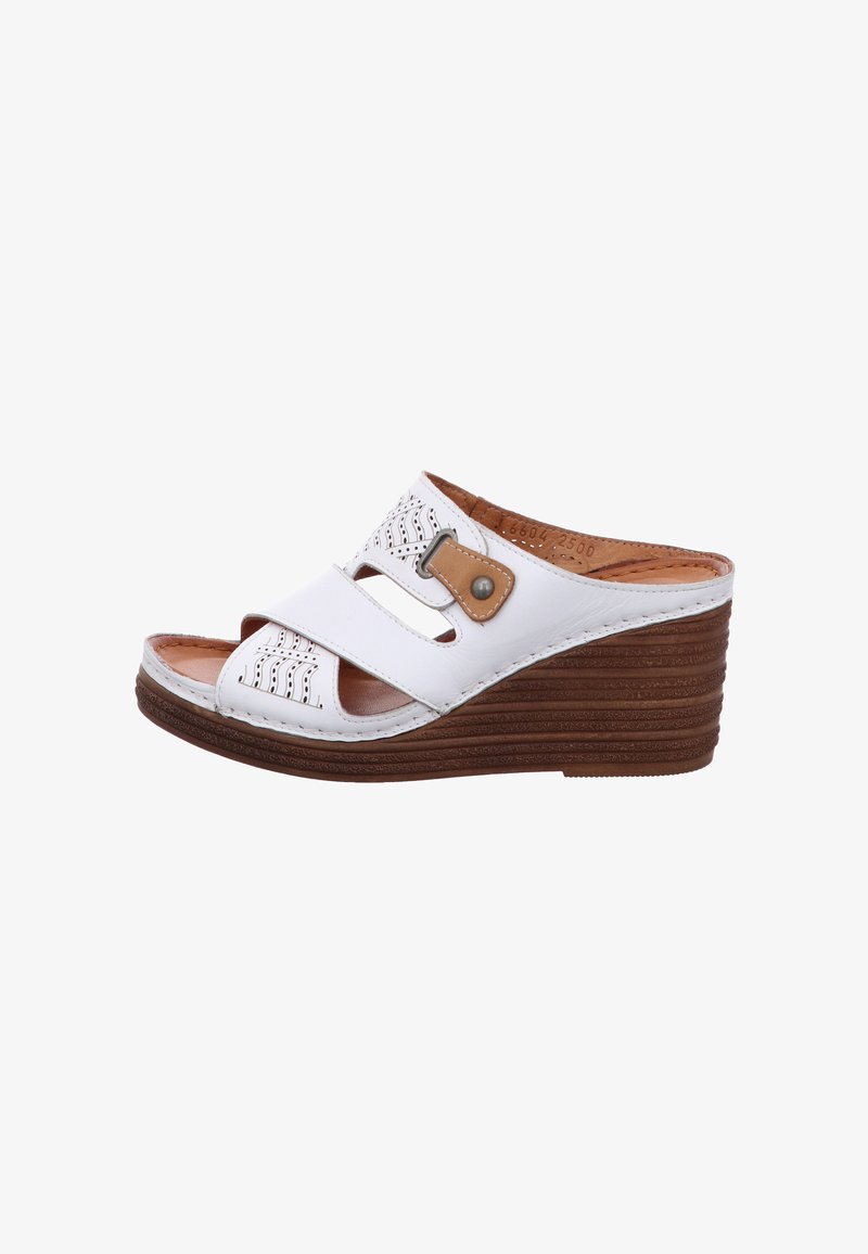 White wedge sandals with perforated upper, two straps, a brown decorative buckle, and a textured brown platform sole.