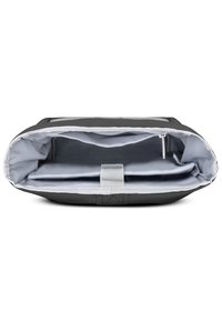 Black fabric laptop bag with light gray interior. Features a zippered main compartment, central divider, and a flat, wide shape.
