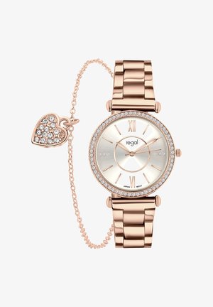 Rose gold watch with a glossy silver dial, Roman numerals, crystal accents, and a linked heart charm on a chain.