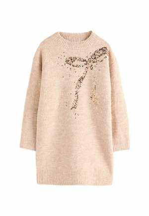 Pull en tricot beige avec col rond, présentant un design de nœud orné de sequins sur le devant et des poignets et un ourlet côtelés.
