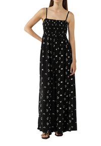 Zwarte maxi jurk met smock-bodice, dunne bandjes en wit abstract patroon. Vloeiende stof met een losse pasvorm, tot aan de enkels.