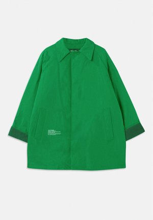 Green outerwear jacket with a collar, two side pockets, and contrasting dark green cuffs. Made from a smooth fabric with text details.