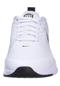 White athletic shoe with fabric upper, lace-up design, black Nike logo, and contrast sole. Features padded collar and textured toe cap.