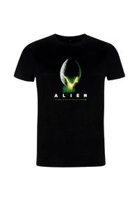 Czarny bawełniany t-shirt z grafiką jajka obcego w zielonych i żółtych akcentach, z napisem "ALIEN" poniżej.