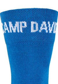 Calza di cotone blu con testo bianco che legge "CAMP DAVID" nella parte superiore. La texture è liscia con un design a costine.