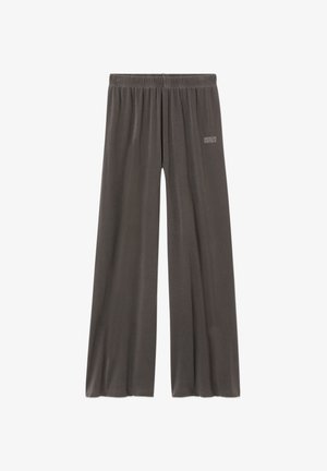 Brīvi pieguļošas tumši pelēkas bikses ar elastīgu jostasvietu un mazu "American Vintage" logotipu augšējā kreisajā augšstilbā.