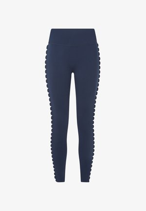 Marine leggings laget av elastisk materiale, med scalloped detaljer langs sidesømmene for ekstra tekstur og design.