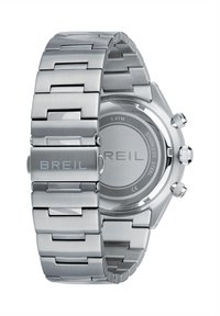 Montre en acier inoxydable argenté avec un bracelet à maillons brossés et polis, un boîtier circulaire et des fonctions de chronographe. Nom de la marque "BREIL" gravé.