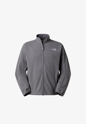 Veste en polaire grise avec fermeture éclair complète à l'avant, col montant, poignets élastiques, et logo "The North Face" sur le côté gauche de la poitrine.