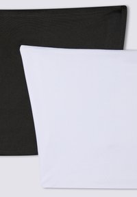 Due federe aderenti in bianco e nero, realizzate in tessuto liscio. La federa nera è posizionata sopra quella bianca, evidenziando i colori contrastanti.