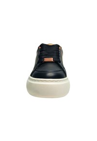 Black leather sneakers with textured white rubber sole, round toe, black laces, and rose gold accents on tongue and eyelets.
