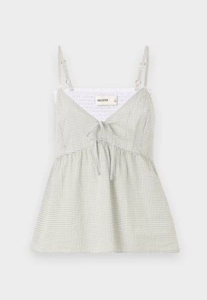 Rohelise ja valge ruudus tahvelkanga särgiga, millel on reguleeritavad rihmad, V-kaelus ja sidumisdetail taljel; sobitav kehosa ja laienev allosa.