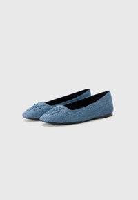 Blue fabric ballet flats with a rounded toe, featuring an embroidered design on the front and a black inner lining. Flat sole.