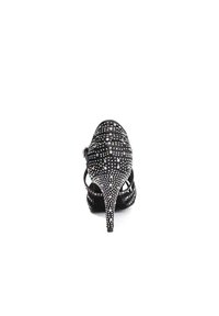 Black high-heeled shoe with a pointed toe, featuring a studded design of rhinestones, adjustable strap, and open back silhouette.
