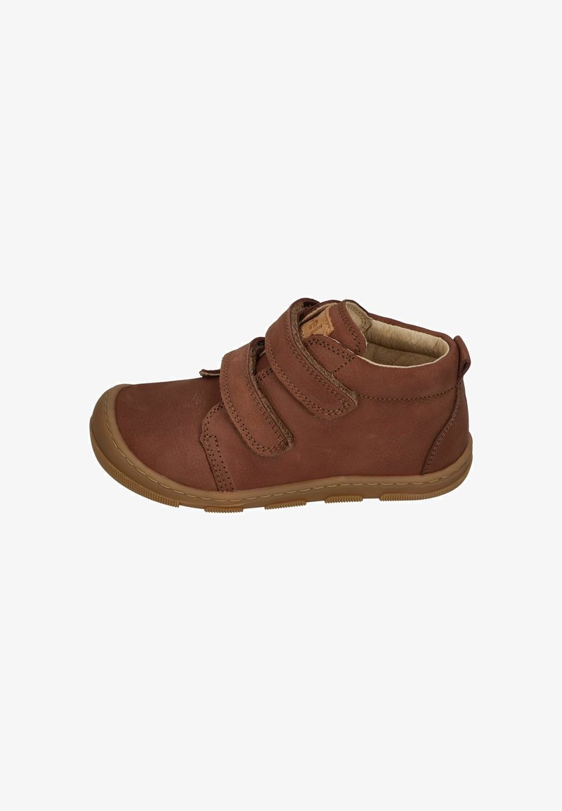 Brown leather ankle boot with two Velcro straps, rubber sole, rounded toe, and stitching details. Soft interior lining for comfort.