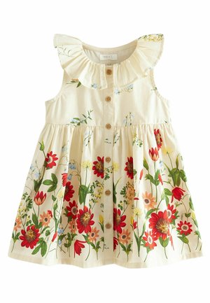 Robe crème sans manches pour tout-petit avec col à volants, boutons en bois sur le devant et imprimé floral rouge et orange en bas.