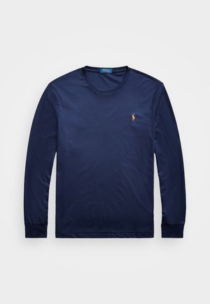 Navy blue long-sleeve t-shirt made of cotton, featuring a round neck and a small embroidered logo on the left chest. Smooth texture.