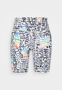 Pantalones cortos ajustados hechos de tela elástica, con una base blanca, tipografía multicolor y un texto en negro con diversas palabras positivas.