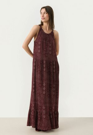 Burgundy maxi dress with a ruffled hem, sleeveless design, and intricate geometric patterns. Smooth fabric with a gathered neckline.