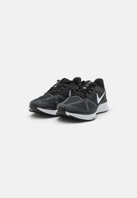 Black and gray athletic shoes with a mesh upper, round toe, white accents, and a textured sole, featuring a cushioned midsole for support.